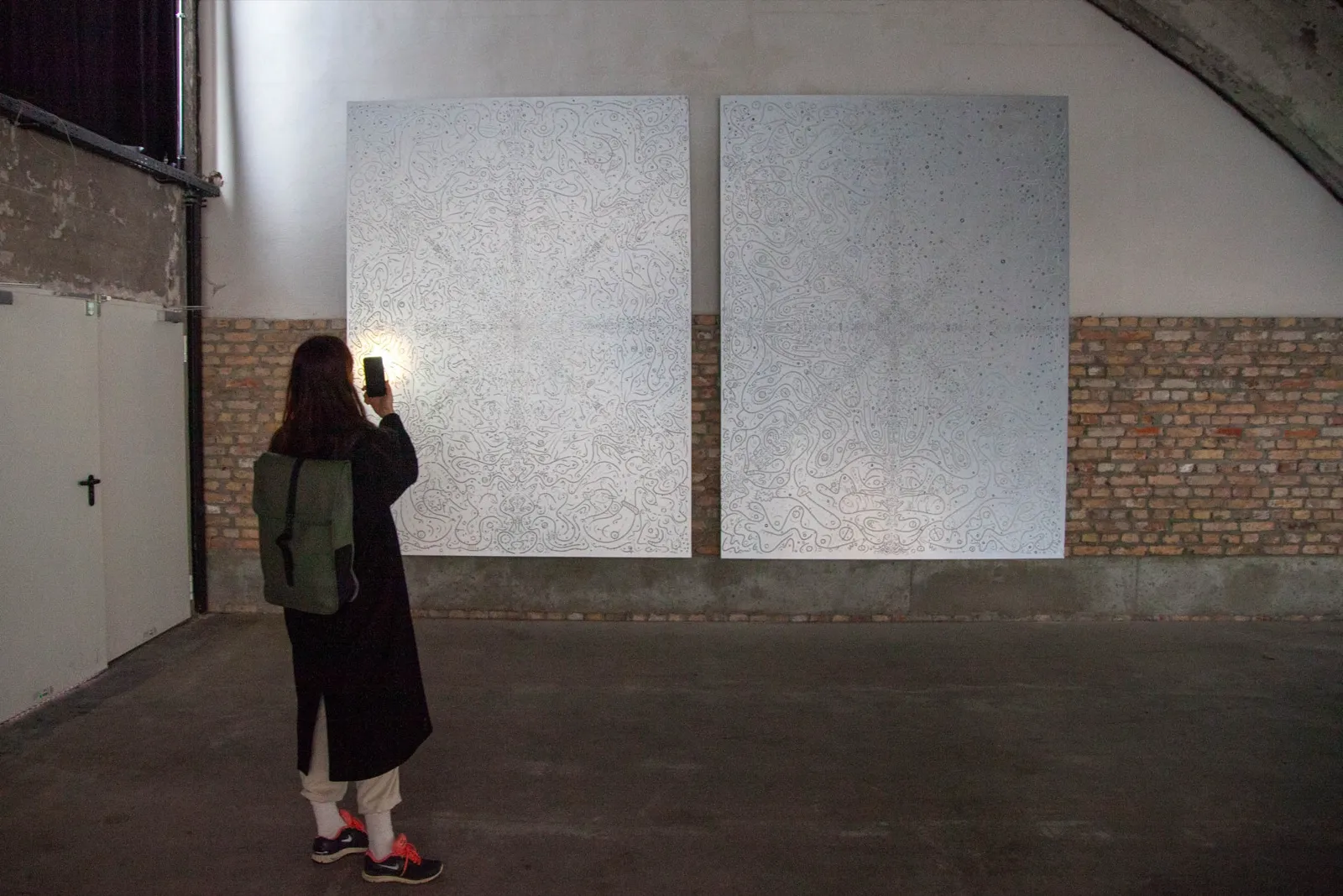 FLOWSTATE — visitor in the hall for scale