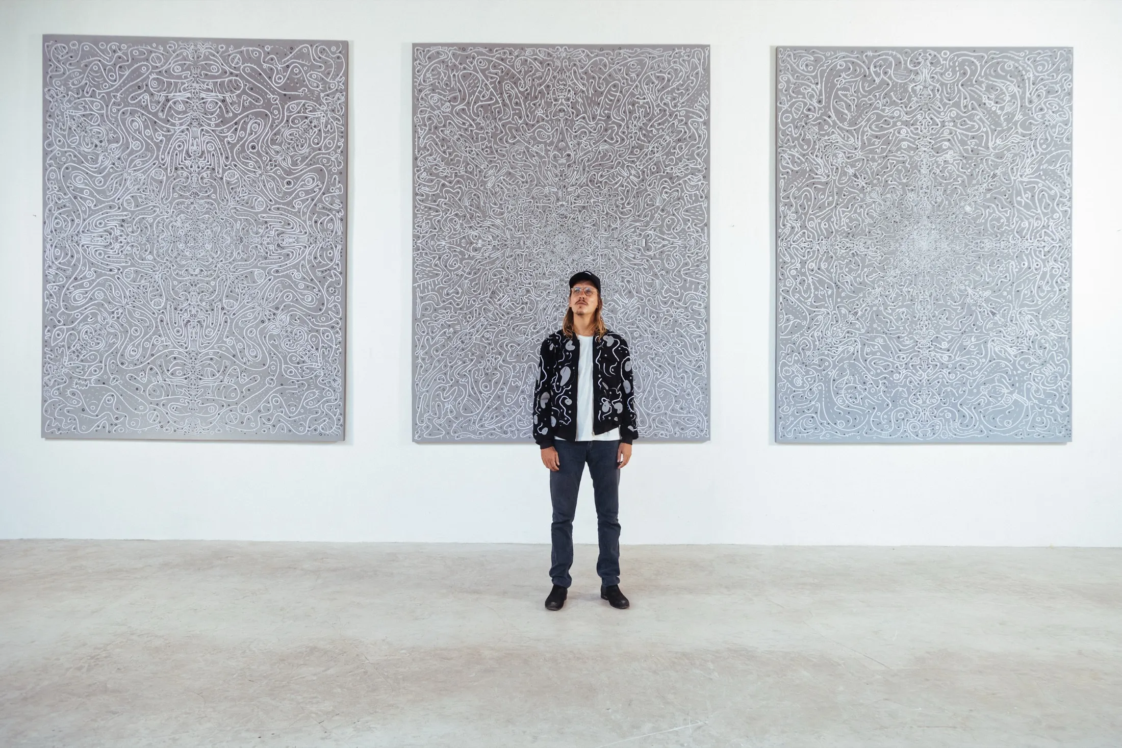 Ole Ukena in his studio with large-scale textile paintings
